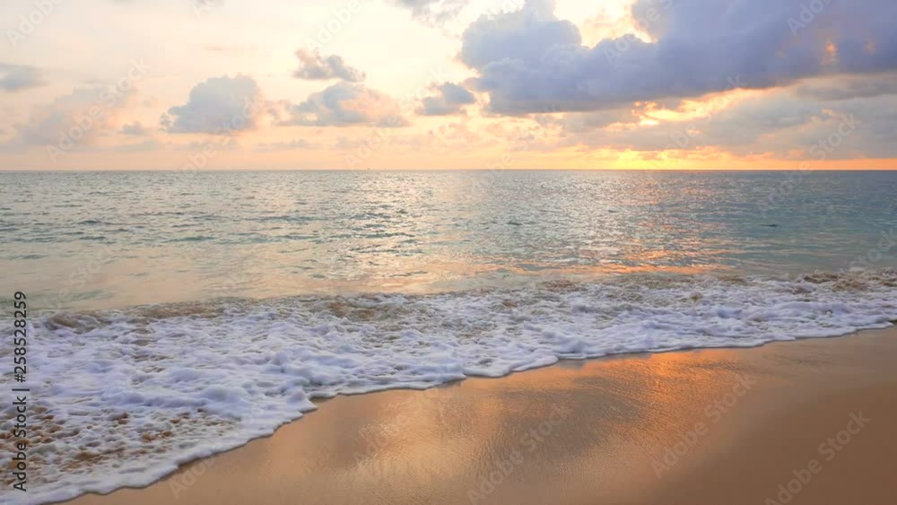 View from the tropical beach with a colorful sky., Beach front view with a cool calm sea waves View from the tropical beach with a colorful sky., Beach front view with a cool calm sea waves