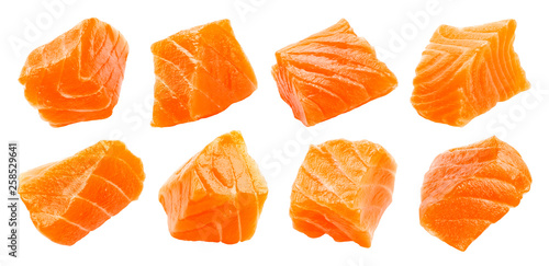 Salmon slices isolated on white background with clipping path, cubes of red fish, ingredient for sushi or salad