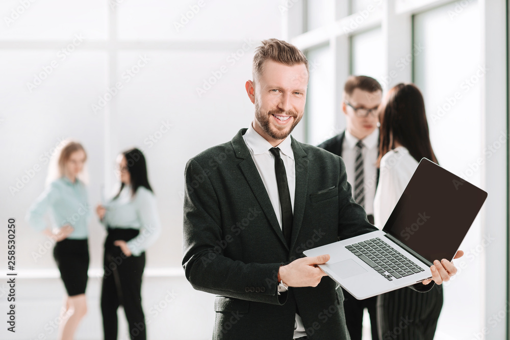 successful businessman showing financial report on laptop screen. successful businessman showing financial report on laptop screen.
