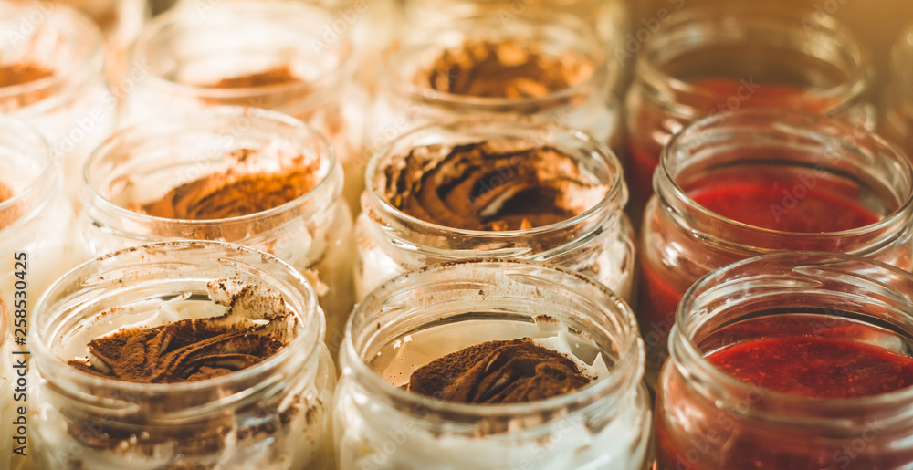 Many delicious desserts in a jar on the window of a cozy cafe. Tasty sweets Many delicious desserts in a jar on the window of a cozy cafe. Tasty sweets
