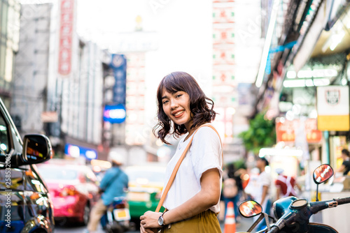 Photography Young Asian Woman Traveler with view at China Town in Bangkok, Thailand