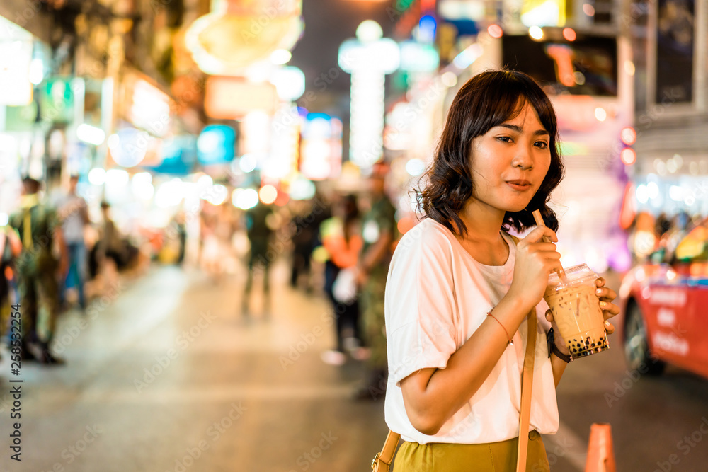 Young Asian Woman Traveler with view at China Town in Bangkok, Thailand Young Asian Woman Traveler with view at China Town in Bangkok, Thailand