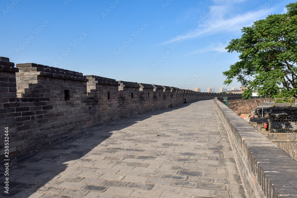 Ancient Chinese Architectural Gateway Wall under Clear Sky and White Cloud, Pingyao County,