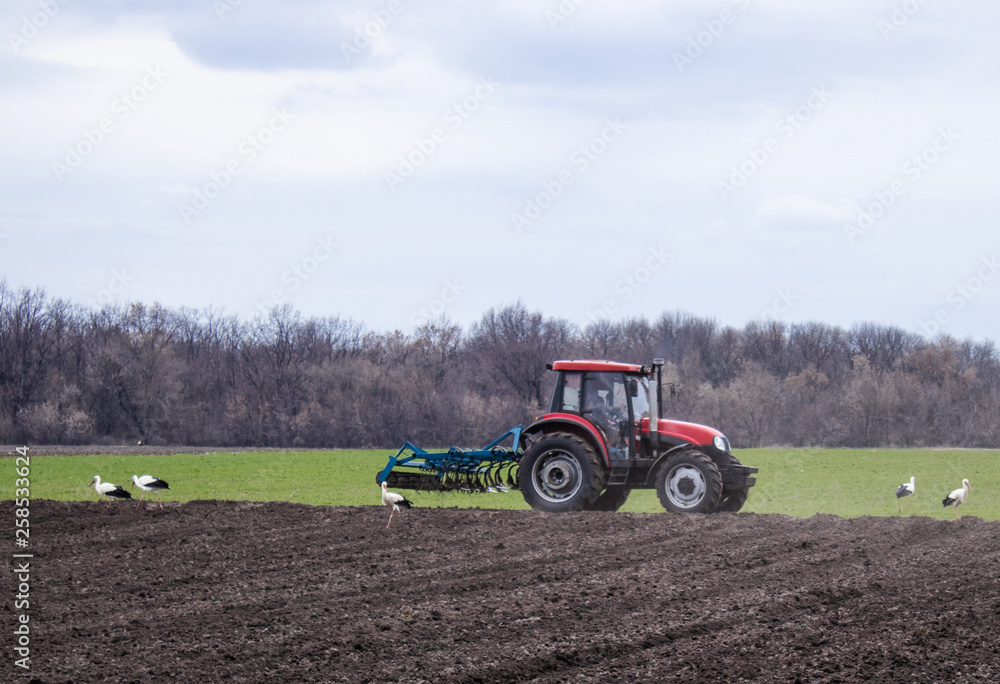 The tractor handles the land. Farmers prepare the land for sowing seeds. The tractor handles the land. Farmers prepare the land for sowing seeds.