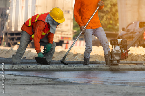 Concrete road construction workers, Construction worker team