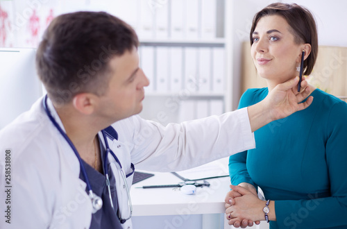 The patient and his doctor in medical office photo