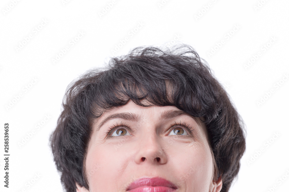 close up. dreaming business woman looking up at copy space