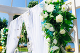 close-up of arch for the wedding ceremony and flowers
