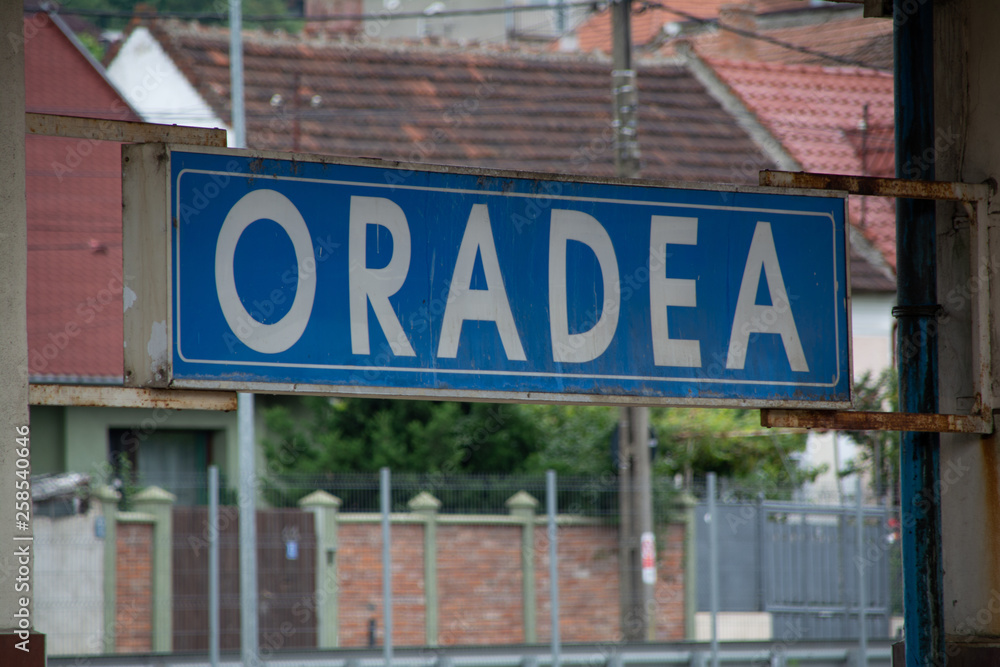 Oradea: An old rusty sign at the oradea train station in romania