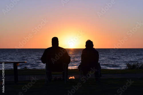 couple on the beach at sunset © Diego