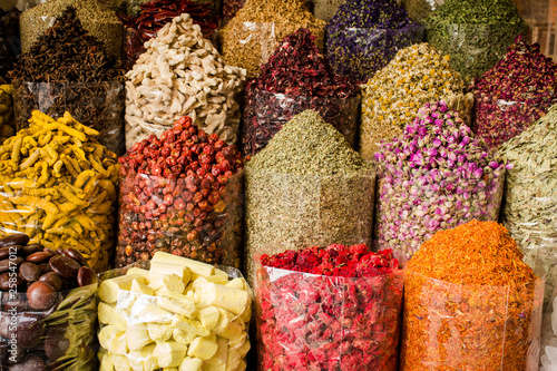 Fotografie Colorful Spices in spice souk Dubai, all dried herbs nuts and flower spices coll