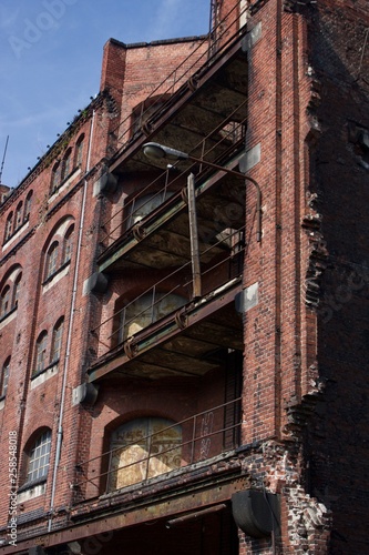 Ruined balconies in an abandoned, made of red brick store