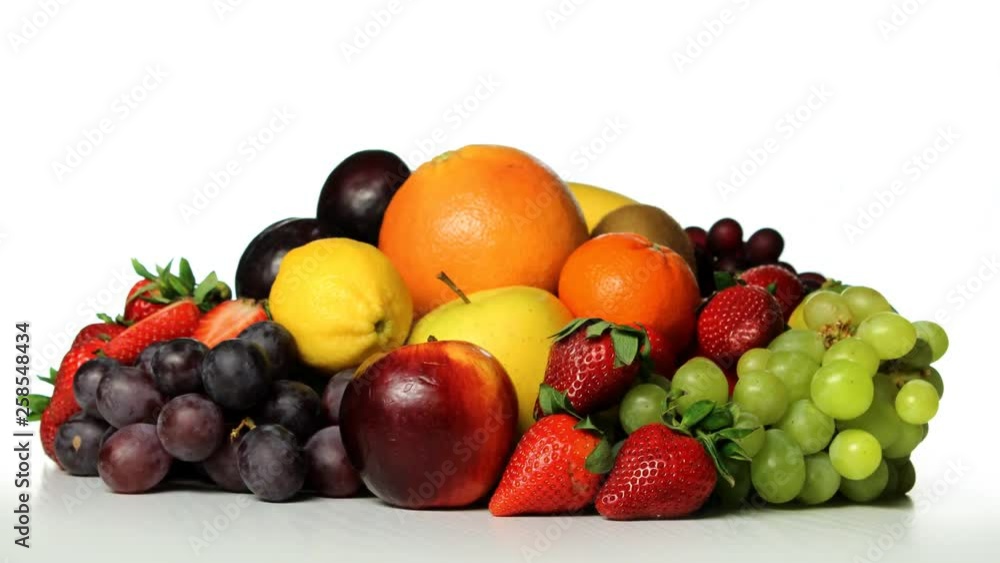 Fresh fruits composition rotating against white background Fresh fruits composition rotating against white background