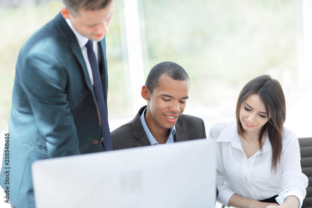project Manager and business team discussing work documents project Manager and business team discussing work documents
