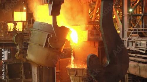 Equipment at the steel plant. Industrial parts of a metallurgical plant or plant. Pouring steel into a ladle.