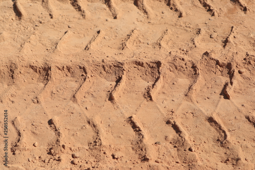Close up the Dirt Road Texture with Tire Marks Close up the Dirt Road Texture with Tire Marks
