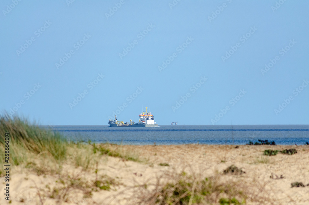Cargo ship passing by Felixstowe shore