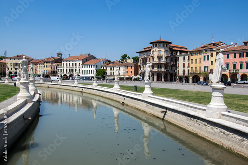 Beautiful summer day on Prato della Valle square with water canal. Amazing italian sculptures. © Iva