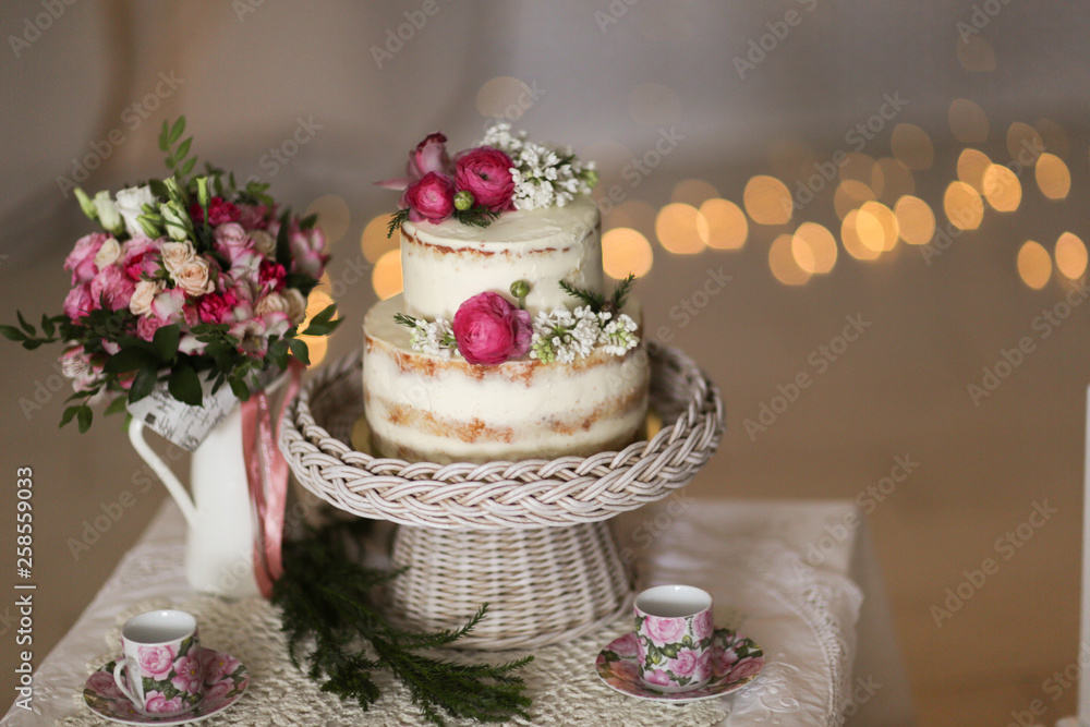 Beautiful cake decorated with fresh flowers Beautiful cake decorated with fresh flowers