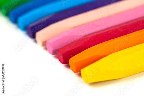 Group of crayons (pencils) stacked on white background