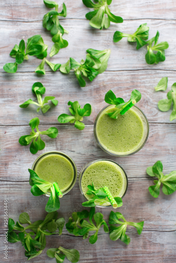 Detox diet concept: Green spinach smoothie on table Detox diet concept: Green spinach smoothie on table