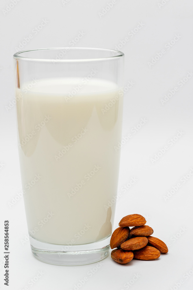 glass of almond milk on white background glass of almond milk on white background