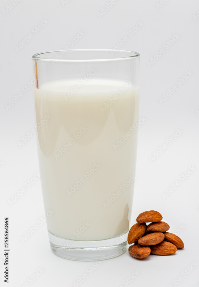 glass of almond milk on white background glass of almond milk on white background
