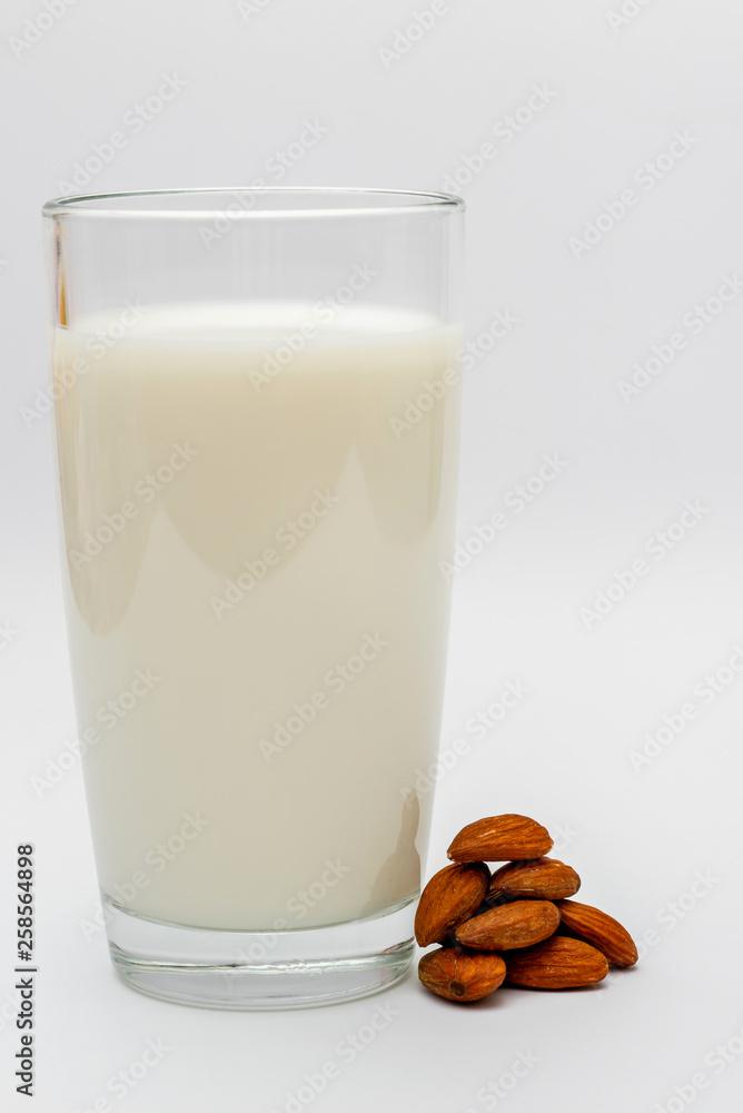glass of almond milk on white background glass of almond milk on white background