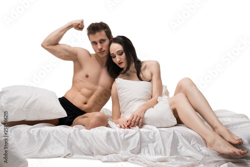 Young couple isolated shot on bed