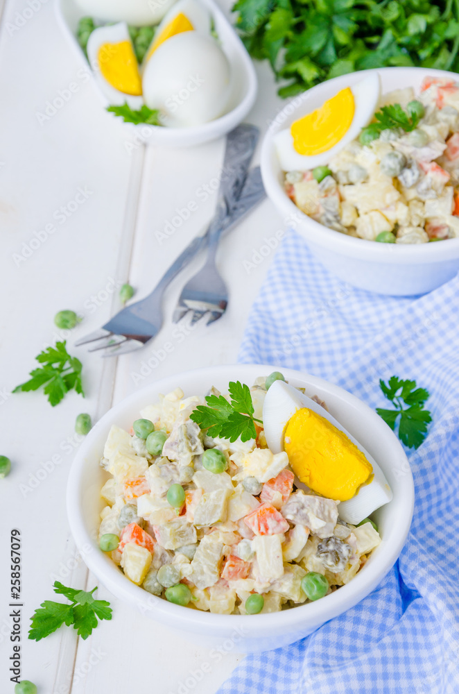 Russian traditional salad Olivier with vegetables and meat Russian traditional salad Olivier with vegetables and meat