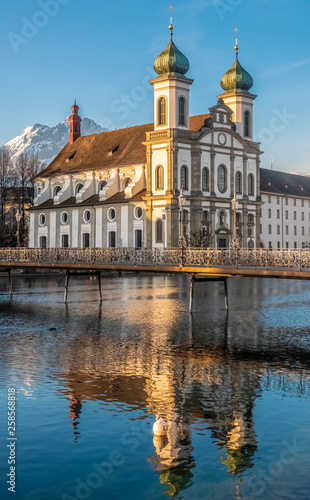 The Jesuit Church of Lucern with Mount Pilatus in the background, Central Switzerland.