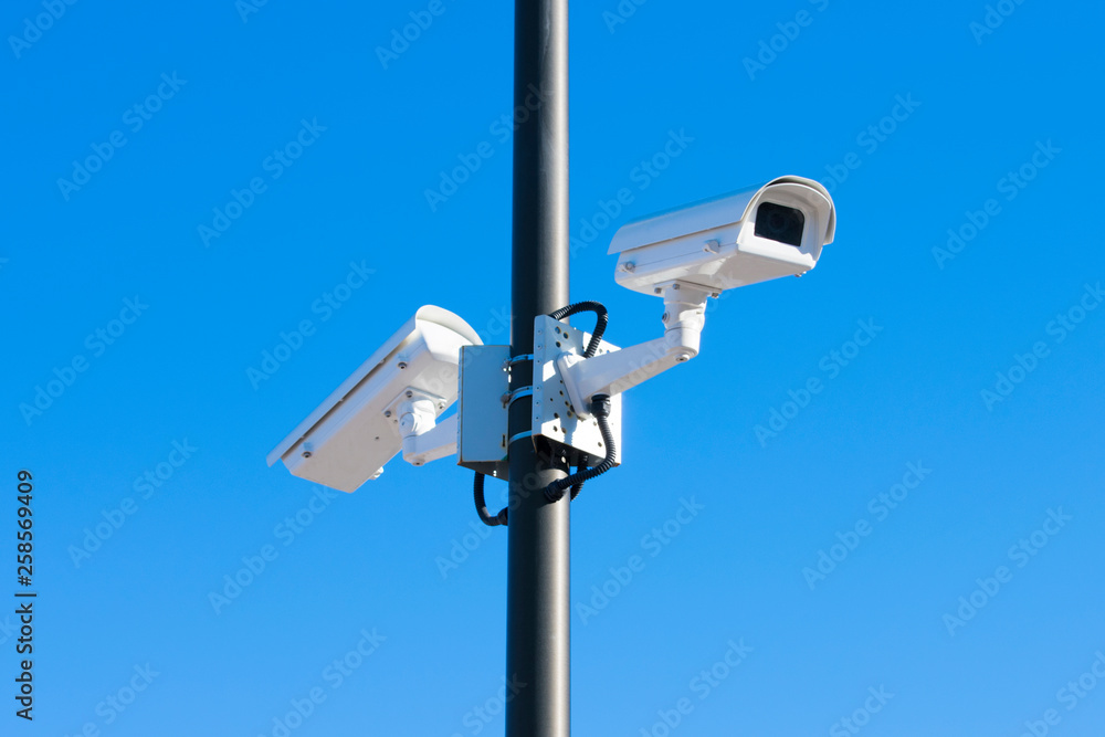 Security cameras on the background of a clear sky. Law enforcement. Security cameras on the background of a clear sky. Law enforcement.