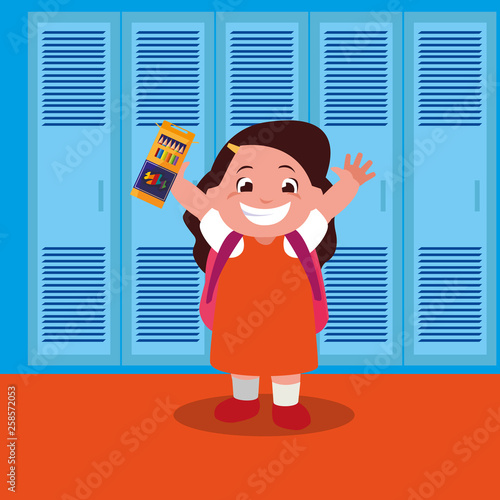 little schoolgirl with schoolbag in school corridor