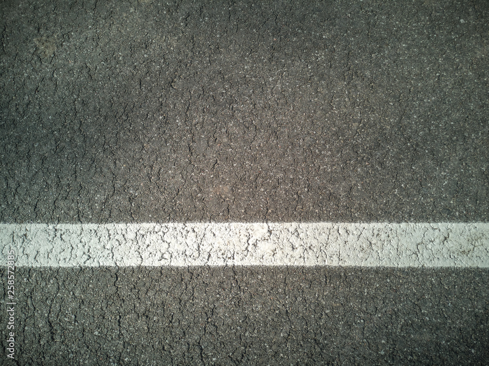 Fototapeta premium Asphalt. Asphalt coating with white tape. Road.