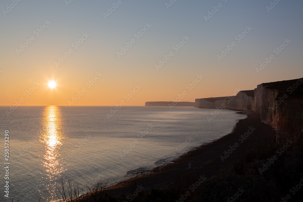 The Seven Sisters cliffs silhouetted at sunset