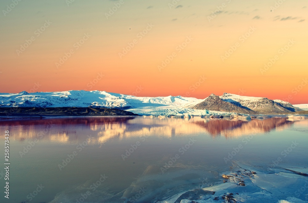 Dawn sky in Iceland over frozen over Lagoon