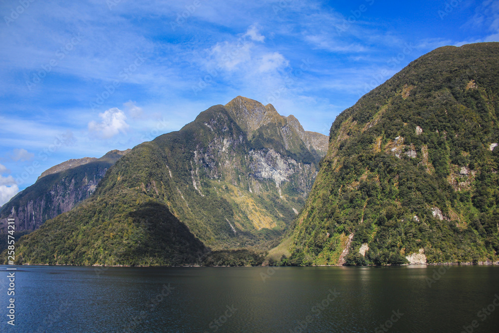 Doubtful Sound cruise - passing beautiful scenery in Fiordland National Park, South Island, New Zealand Doubtful Sound cruise - passing beautiful scenery in Fiordland National Park, South Island, New Zealand