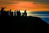 People Enjoying the Sunset over the Pacific Ocean in California