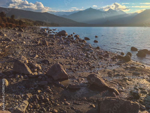 rocky beach at Lake Manapouri in Southland, Fiordland National Park, South Island, New Zealand photo