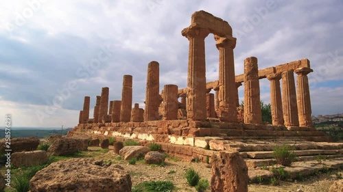 Panning view of Greek temple of Juno in the valley of temples in Sicily before sunset photo
