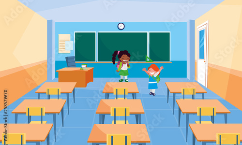 happy little school interracial girls in the classroom