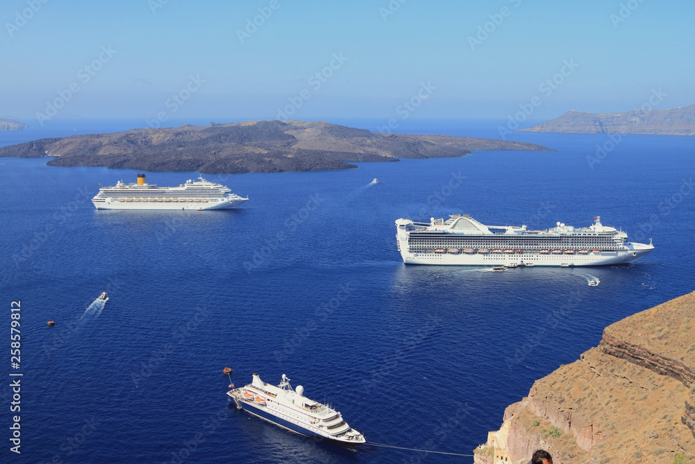 Cruise liners on parking at volcanic island. Santorini, Greece