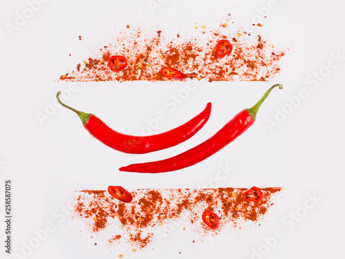 Raw fresh organic, red pepper flakes and dried ground chili pepper with sliced