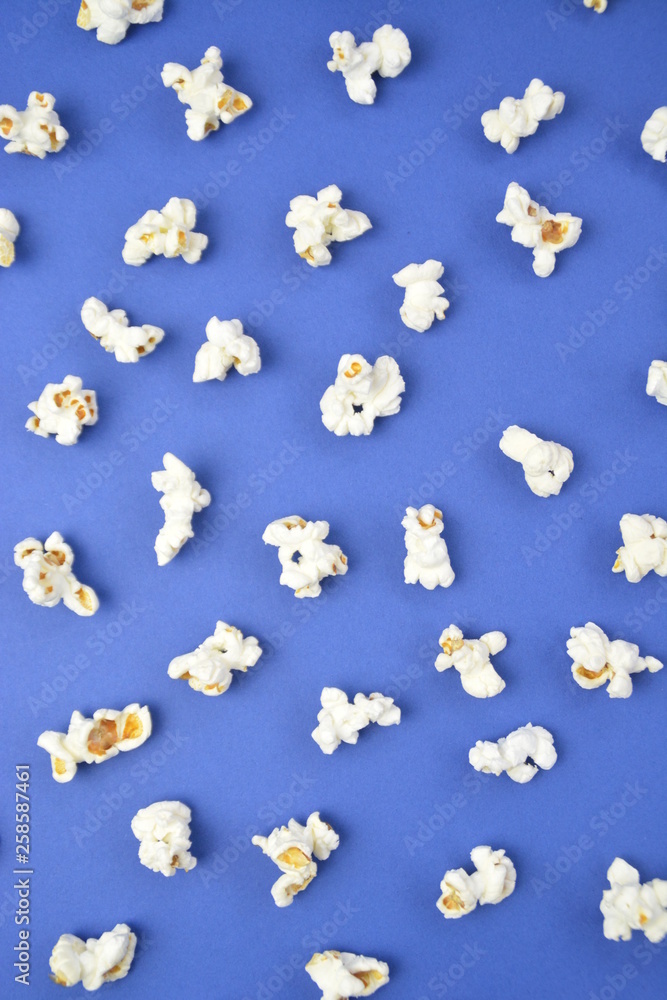 Single popcorn on a monochrome background - concept with fresh made popcorn on a monochrome background Single popcorn on a monochrome background - concept with fresh made popcorn on a monochrome background