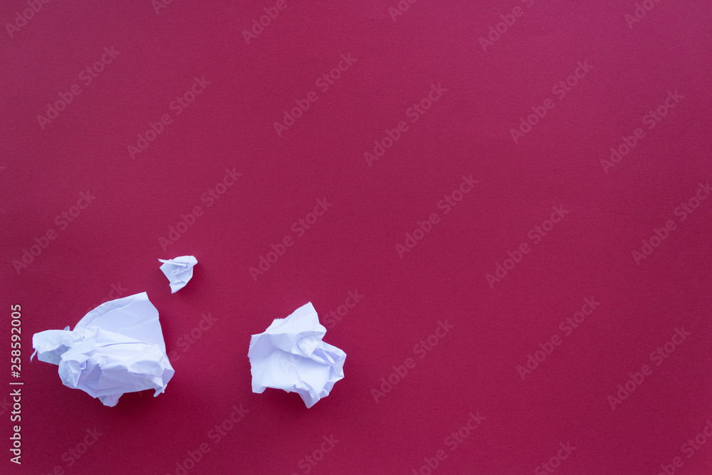 idea. crumpled paper on red background