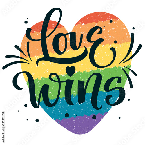 Gay Pride text Love Wins with splashes and dots decor on colorful gay rainbow heart background