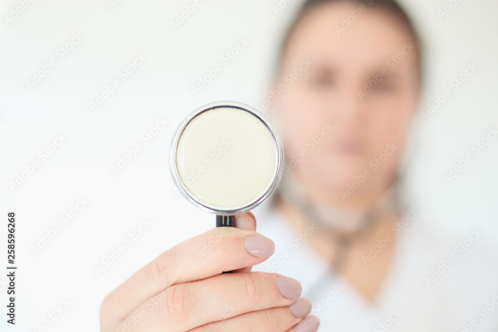 Portrait of beautiful female doctor. Medicine representative concept on brick background Portrait of beautiful female doctor. Medicine representative concept on brick background