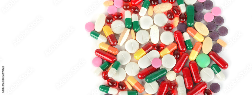 Сolorful pills on white background. Free space for text. Wide photo . Сolorful pills on white background. Free space for text. Wide photo .