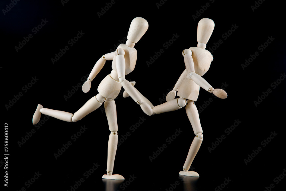 Mannequin dolls in interaction isolated on black background Mannequin dolls in interaction isolated on black background