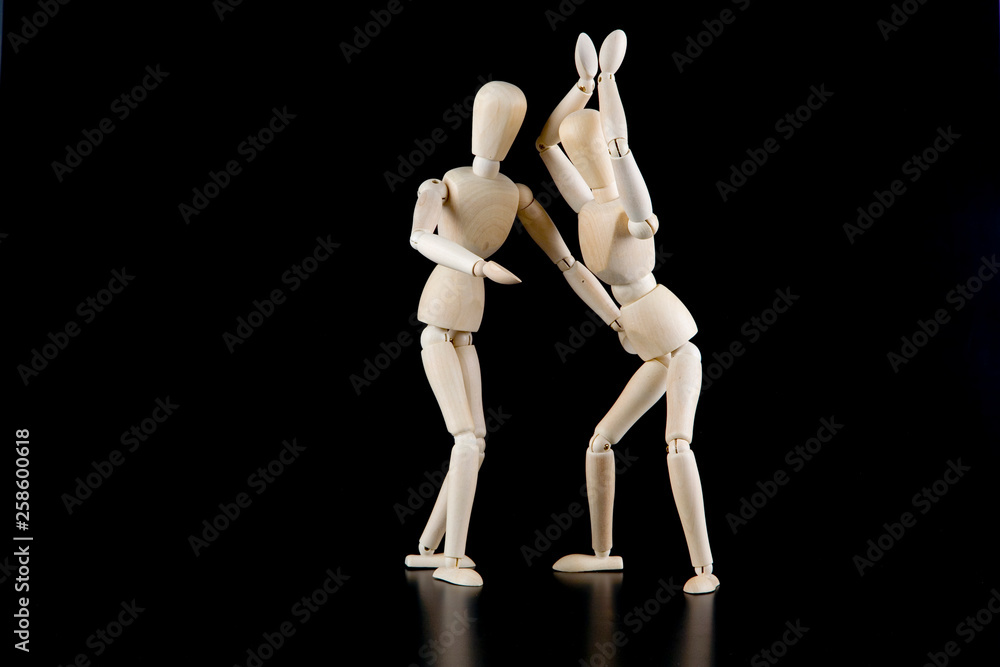Mannequin dolls in interaction isolated on black background Mannequin dolls in interaction isolated on black background